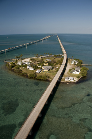Pigeon Key is a small historic island beneath the Old Seven Mile Bridge that housed workers constructing the Florida Keys Over-Sea Railroad in the early 1900s. 